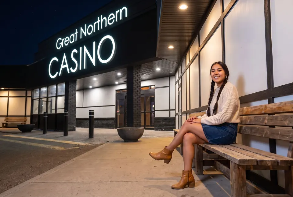Woman on a bench outside Great Northern Casino